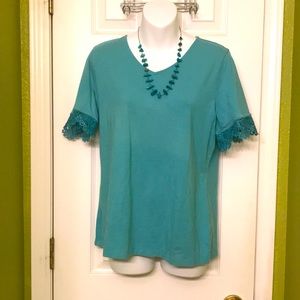 Turquoise shirt with lace detailing and v neck dress up or down